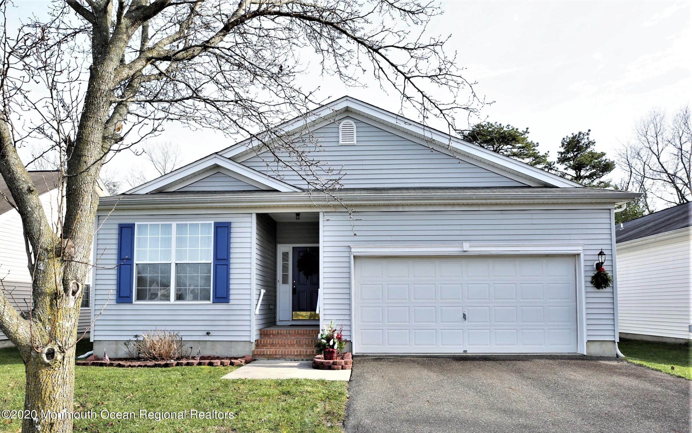 a front view of a house with garage