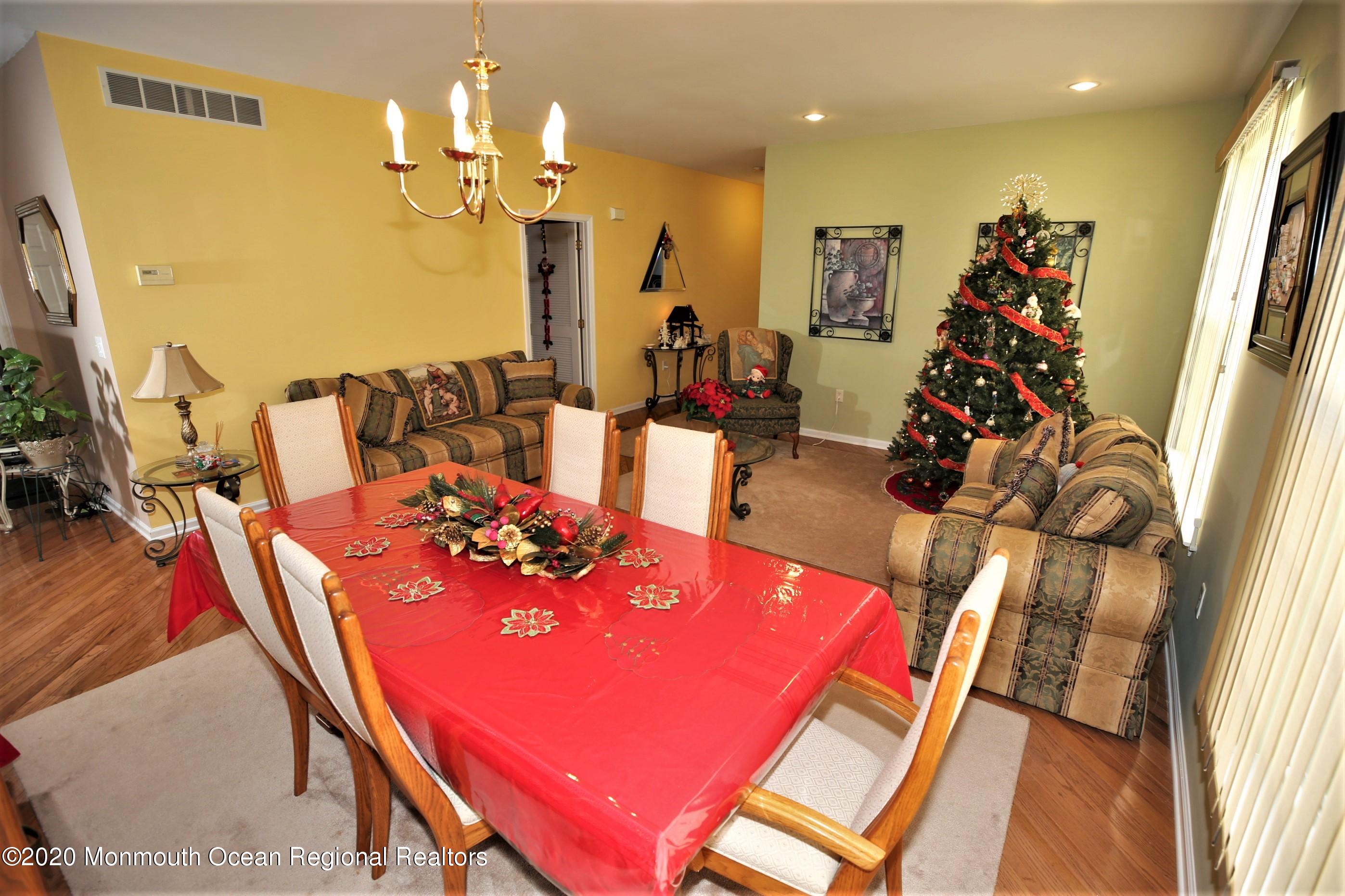 25 Byron Road Brick, NJ 08724 - Photo 12 of 35 a view of a dining room with furniture and a chandelier