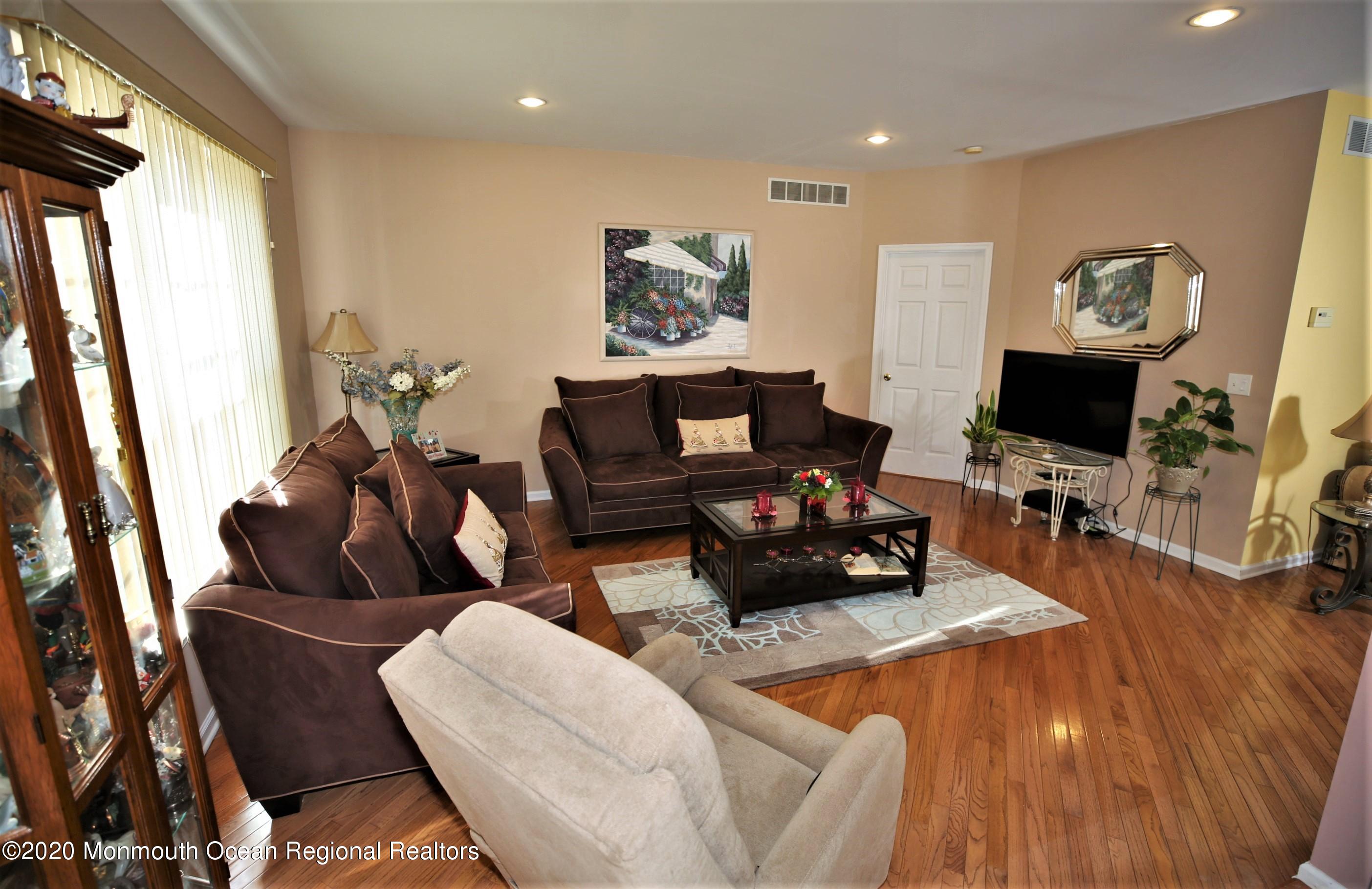 25 Byron Road Brick, NJ 08724 - Photo 14 of 35 a living room with furniture and a flat screen tv