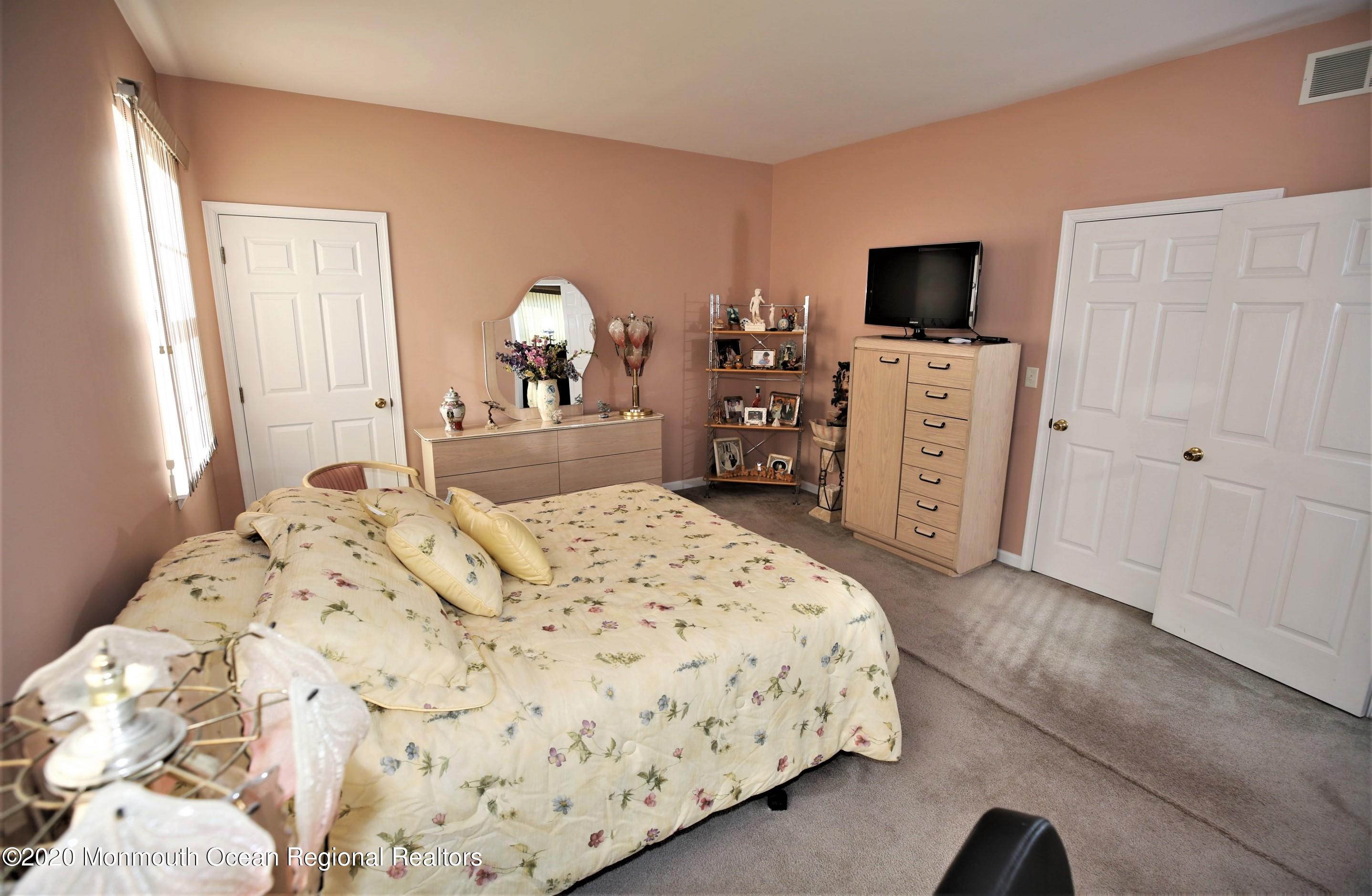 25 Byron Road Brick, NJ 08724 - Photo 20 of 35 a bedroom with a bed and a flat screen tv