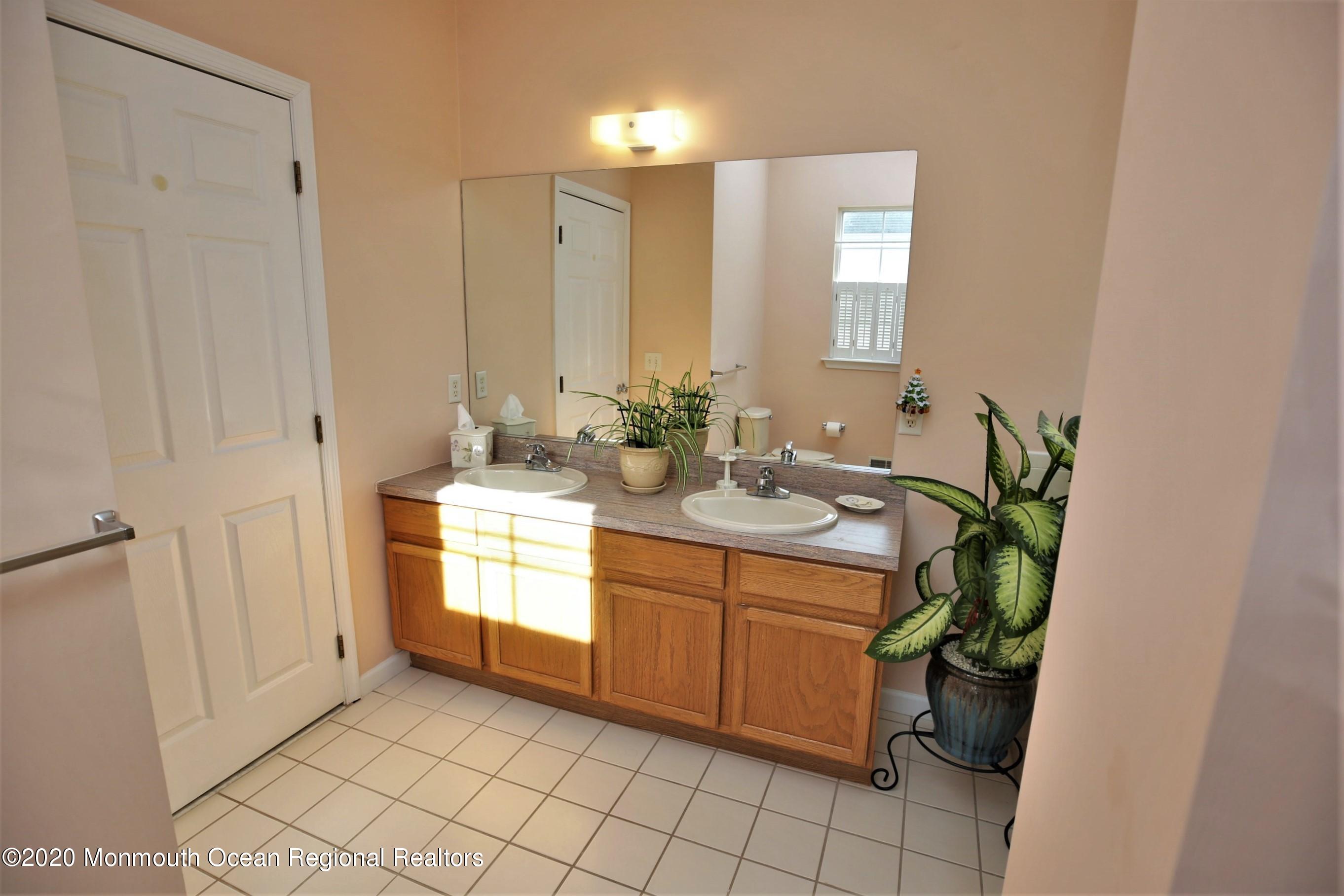 25 Byron Road Brick, NJ 08724 - Photo 22 of 35 a spacious bathroom with a double vanity sink and a mirror