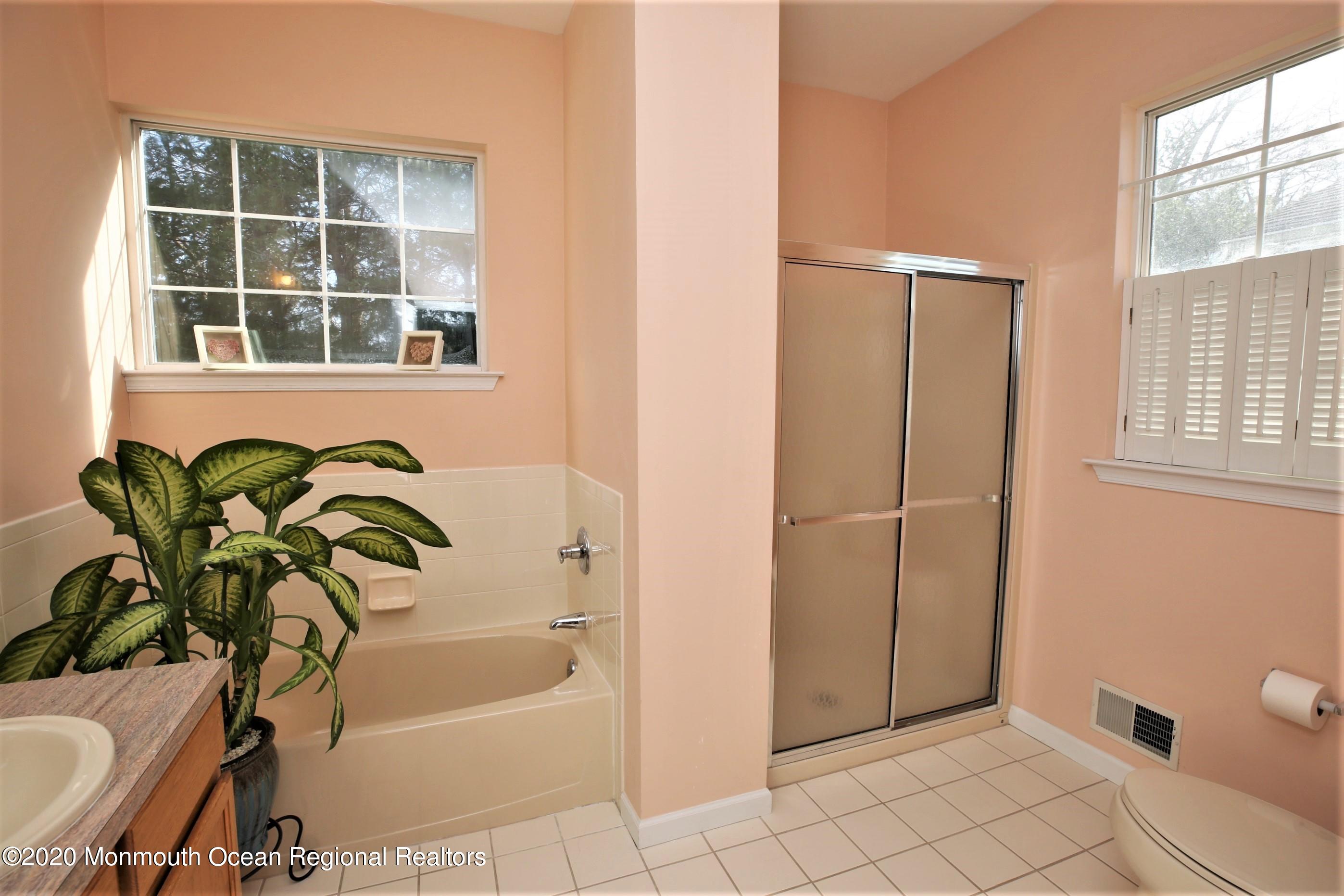 25 Byron Road Brick, NJ 08724 - Photo 23 of 35 a view of a bathroom with a tub and shower