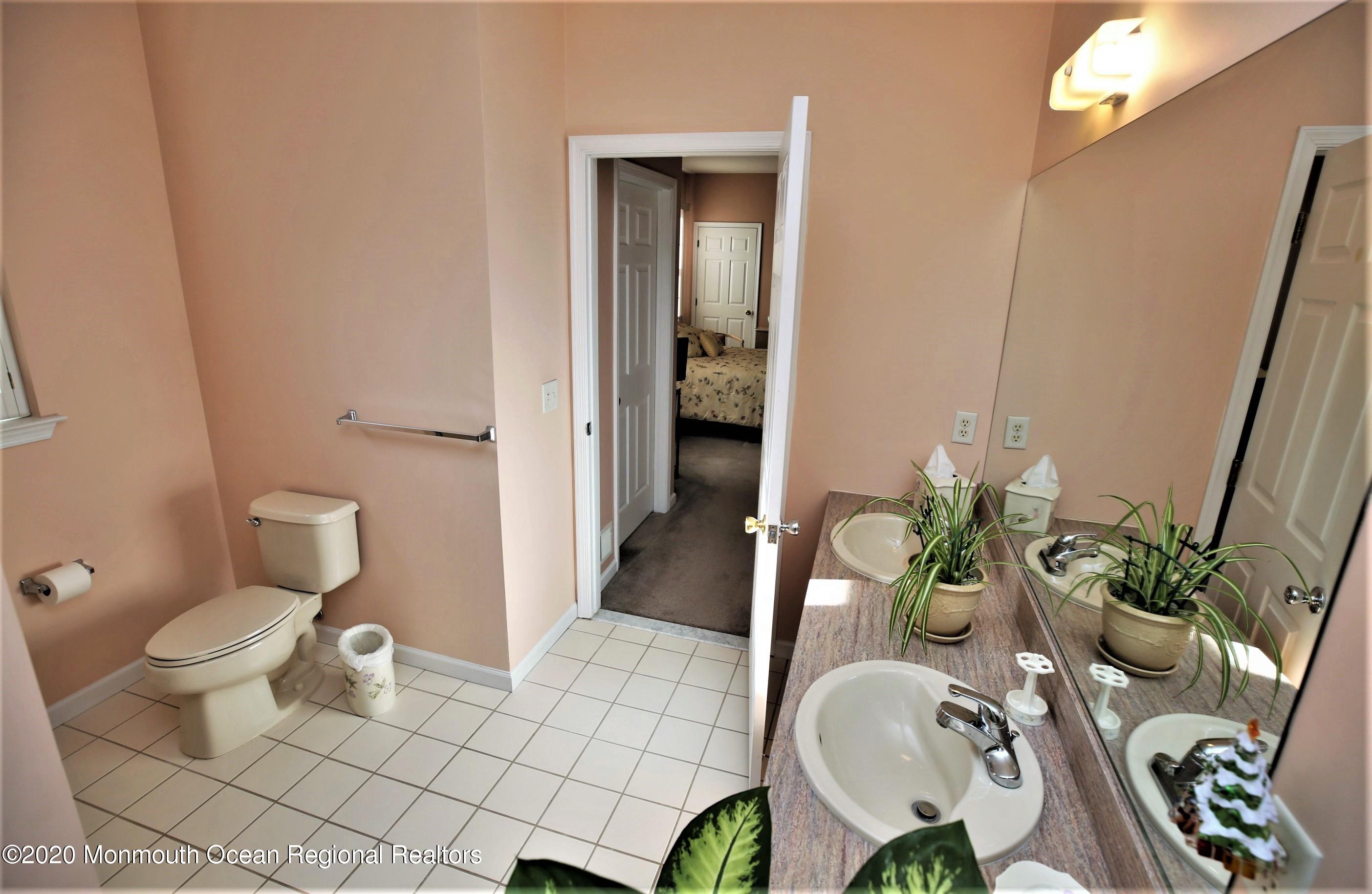 25 Byron Road Brick, NJ 08724 - Photo 25 of 35 a bathroom with a granite countertop toilet and a sink