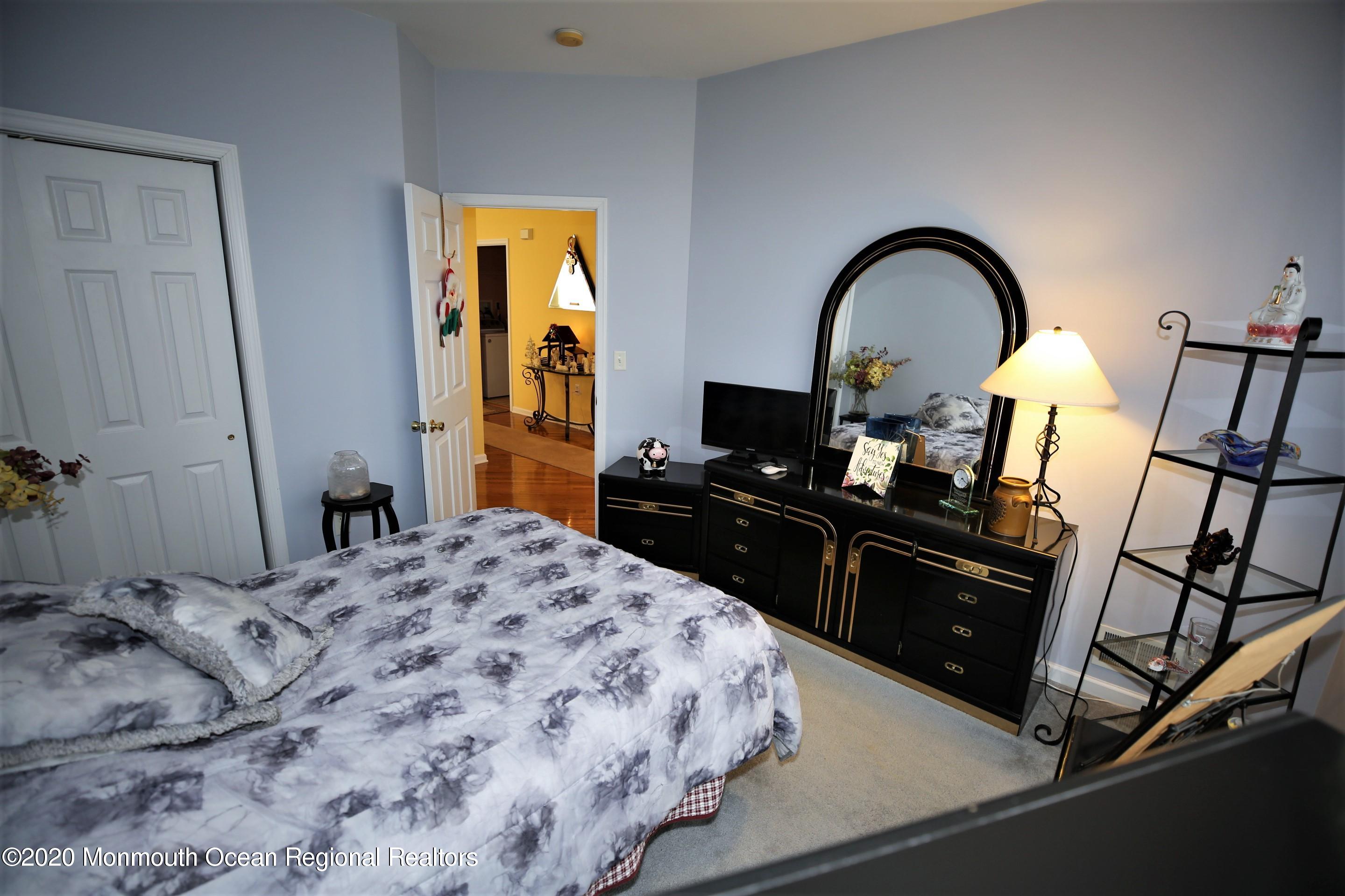 25 Byron Road Brick, NJ 08724 - Photo 27 of 35 a bedroom with a bed and wooden floor