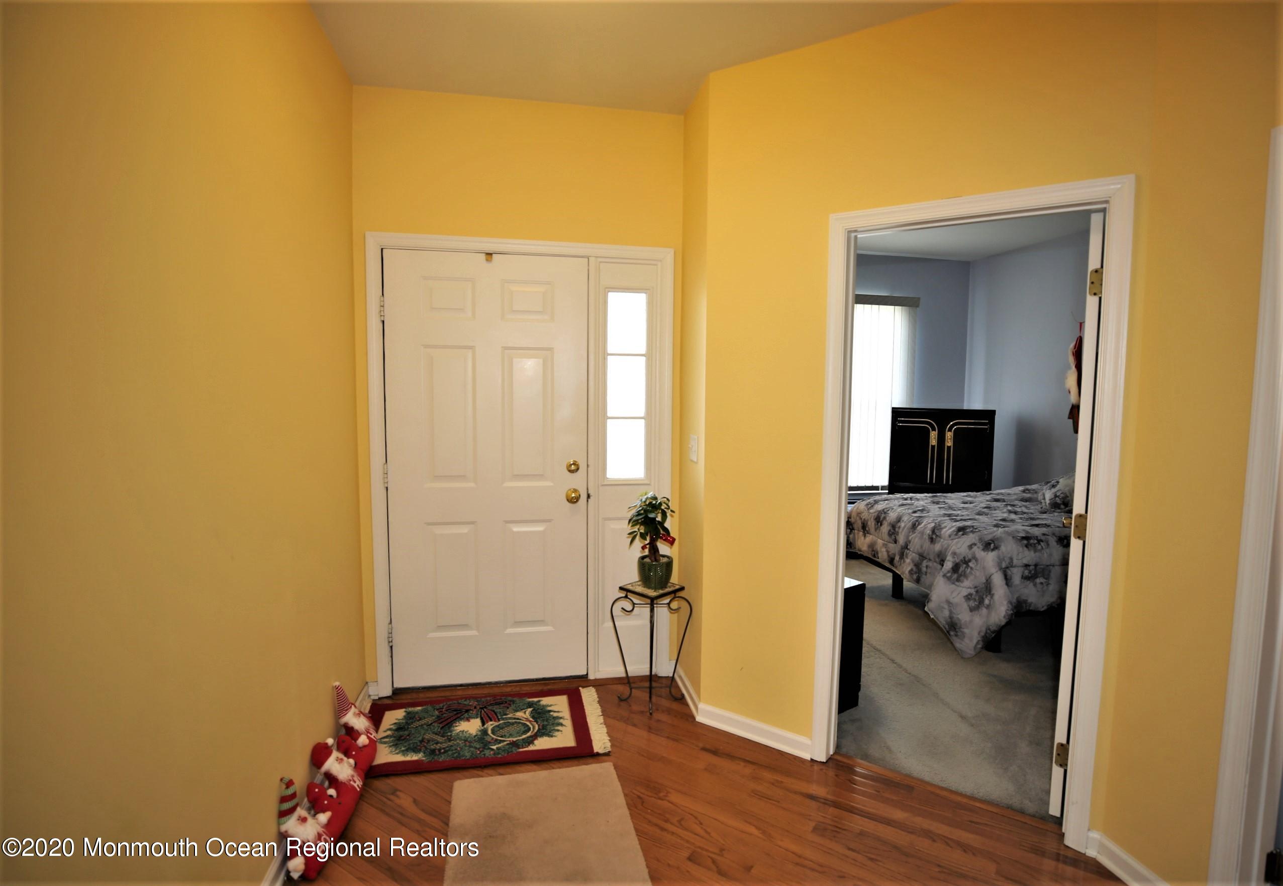 25 Byron Road Brick, NJ 08724 - Photo 7 of 35 a bedroom with a bed and wooden floor