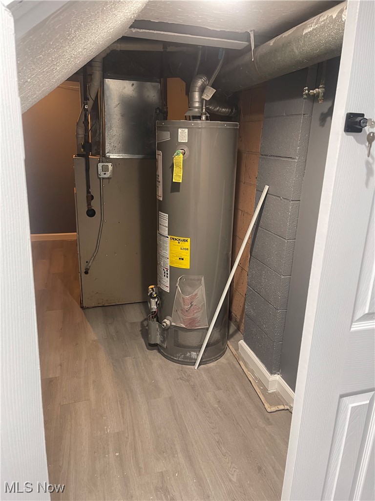 603 Liberty Road Youngstown, OH 44505 - Photo 36 of 42 Utility room with water heater and heating unit