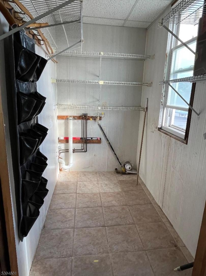 469 Crooks Avenue Clifton, NJ 07011 - Photo 12 of 12 a view of an empty walk in closet