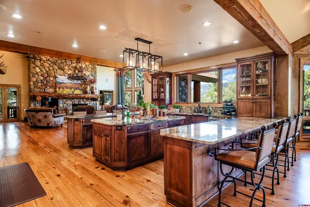 a large kitchen with lots of counter space and windows