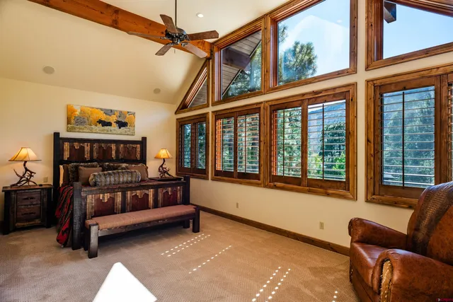 a bedroom with furniture and a window