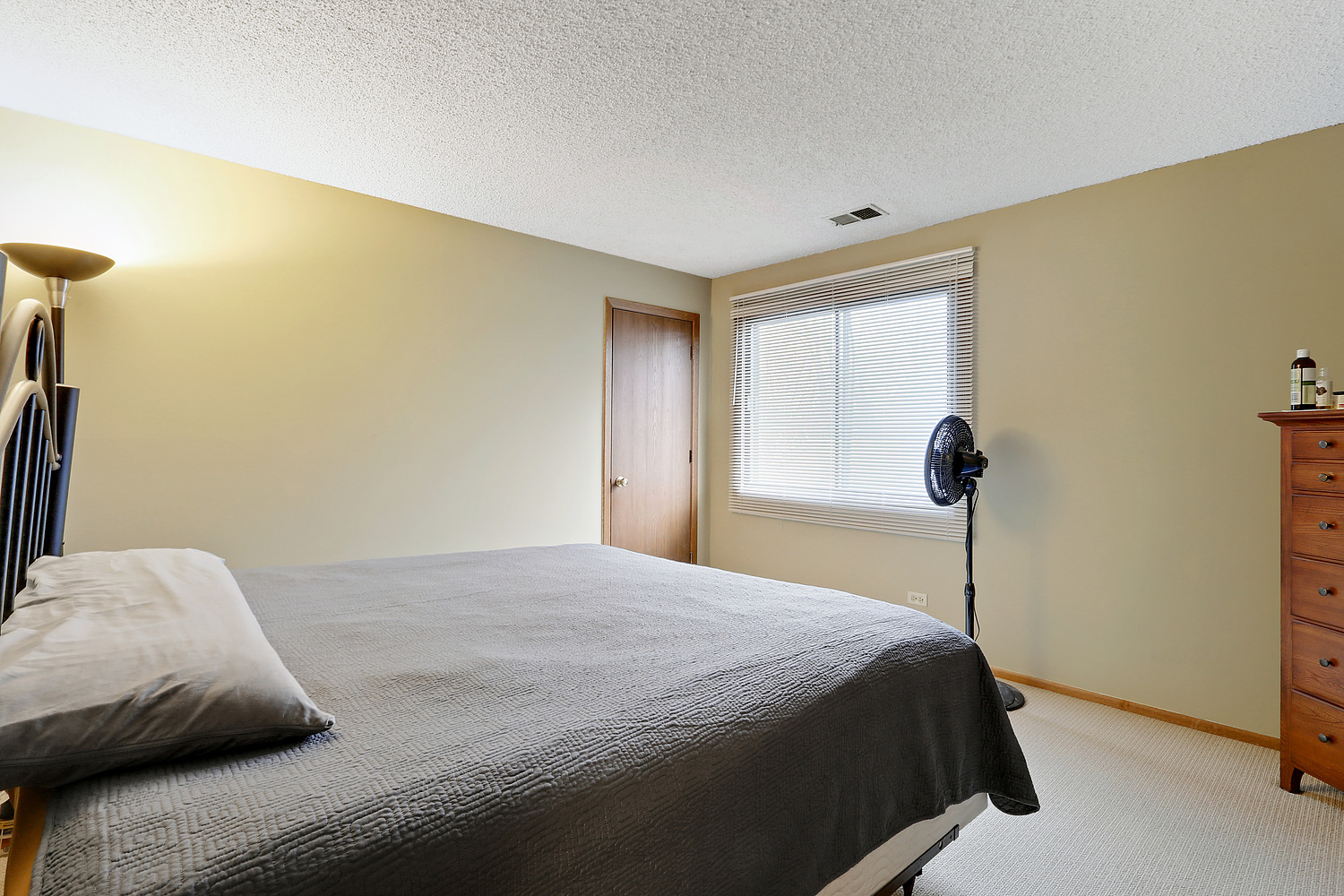19444 Wolf Road, Unit 4 Mokena, IL 60448 - Photo 2 of 3 a bedroom with a bed and a window