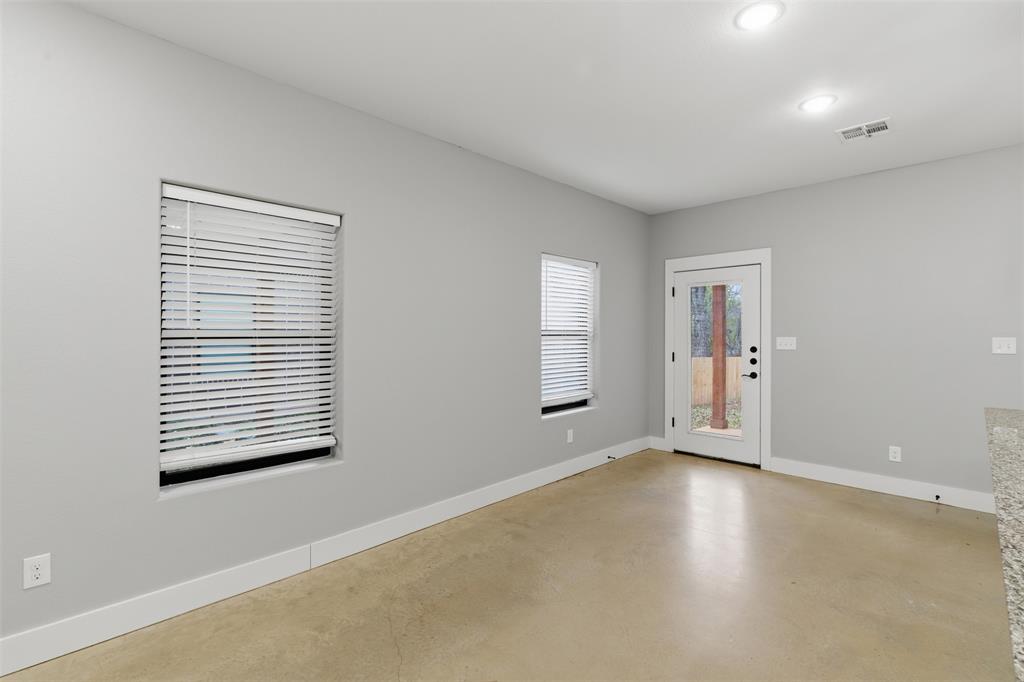 116 Harrison Street Denison, TX 75021 - Photo 11 of 25 Unfurnished room with finished concrete floors and recessed lighting