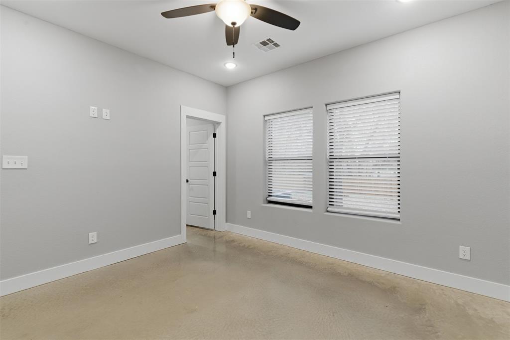 116 Harrison Street Denison, TX 75021 - Photo 18 of 25 Empty room with finished concrete flooring, ceiling fan, and recessed lighting
