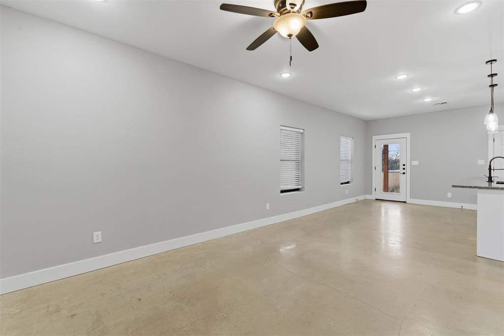 116 Harrison Street Denison, TX 75021 - Photo 3 of 25 Unfurnished living room with concrete floors, recessed lighting, and ceiling fan