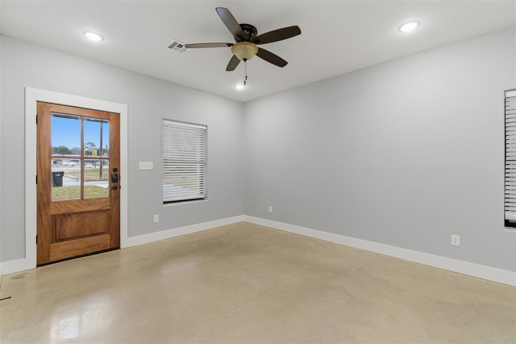 116 Harrison Street Denison, TX 75021 - Photo 9 of 25 Unfurnished room featuring a ceiling fan, finished concrete flooring, and recessed lighting
