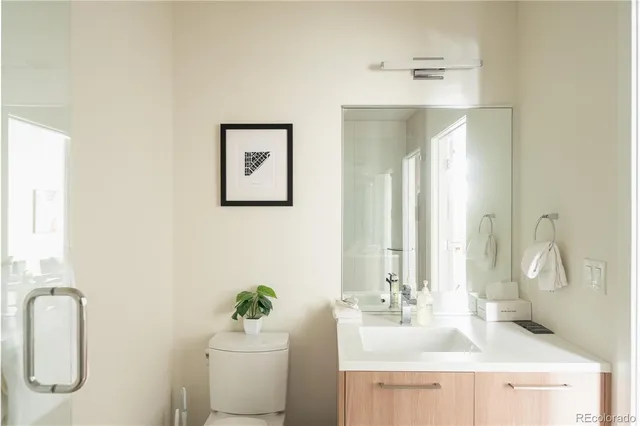 a bathroom with a sink vanity and a mirror