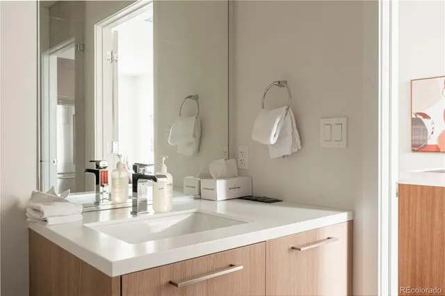 a bathroom with a sink and a mirror