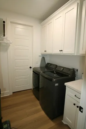 a view of a storage and utility room with closet