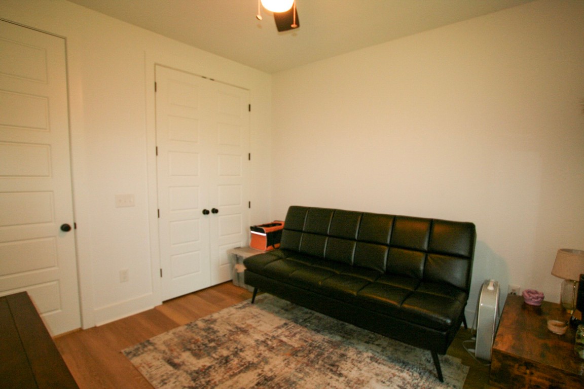 455 East Walton Road Lumberton, TX 77657 - Photo 14 of 31 a living room with a couch and a rug