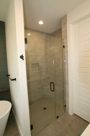 a bathroom with a shower and a toilet