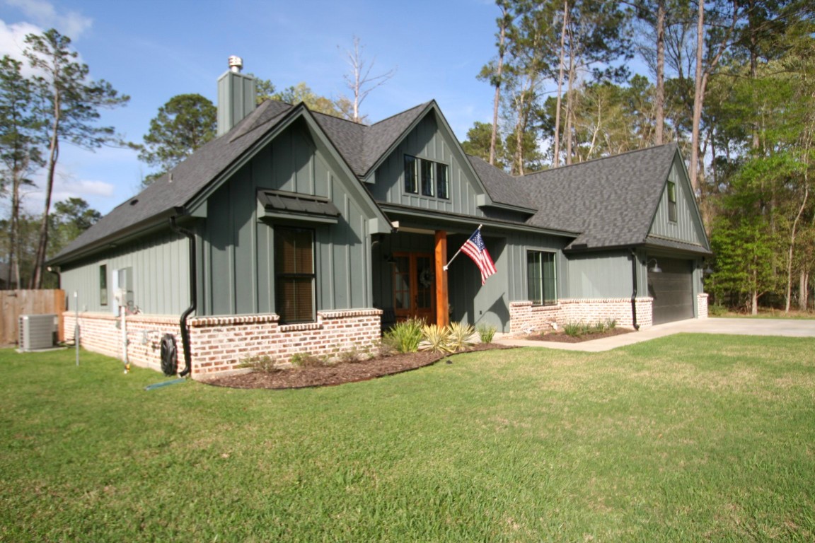 455 East Walton Road Lumberton, TX 77657 - Photo 31 of 31 a view of a house with a yard and sitting area