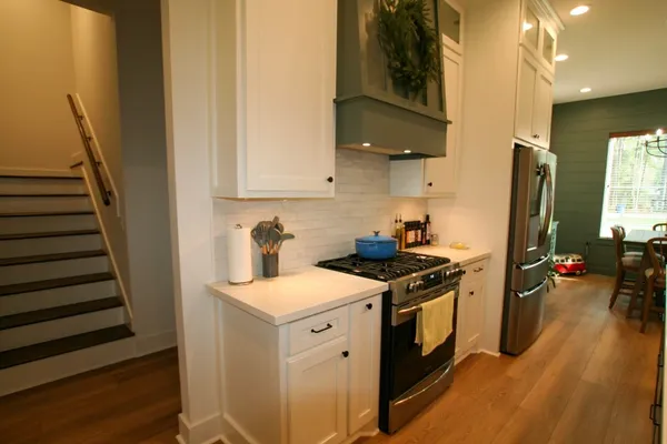 a view of a kitchen with electric appliances