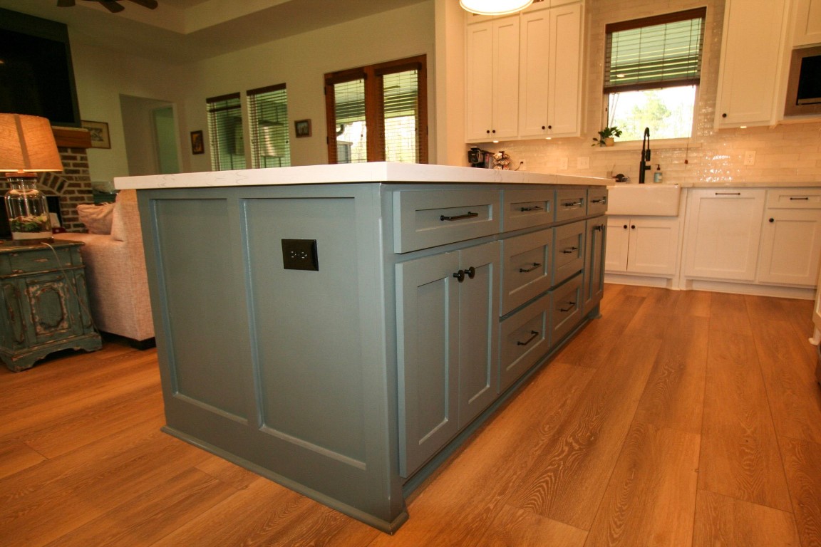 455 East Walton Road Lumberton, TX 77657 - Photo 9 of 31 a kitchen with stainless steel appliances a sink cabinets and wooden floor