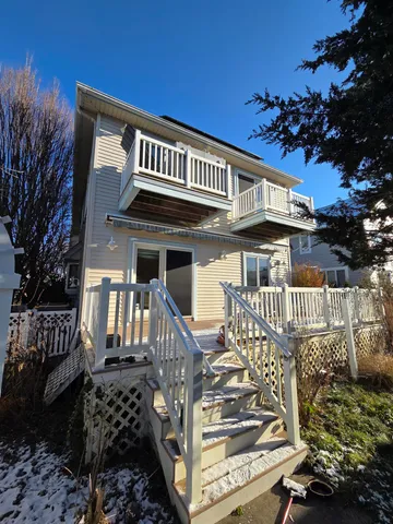 a view of a balcony with wooden floor