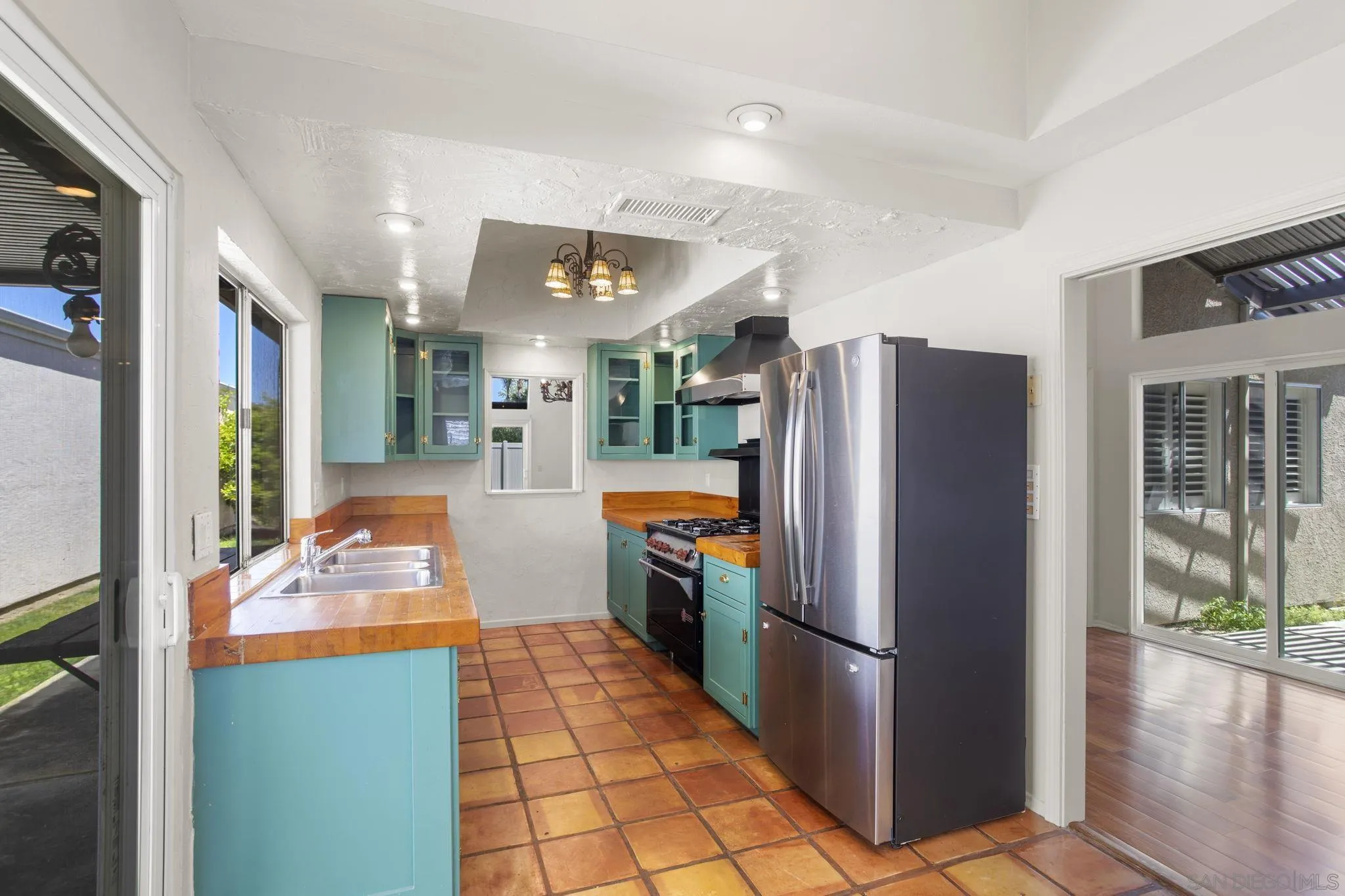 541 Cloudview Lane Encinitas, CA 92024 - Photo 5 of 25 a kitchen with stainless steel appliances granite countertop a refrigerator and a sink