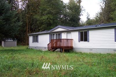 154 Independence Road Southwest Rochester, WA 98579 - Photo 1 of 1 a view of a house with a yard and sitting area