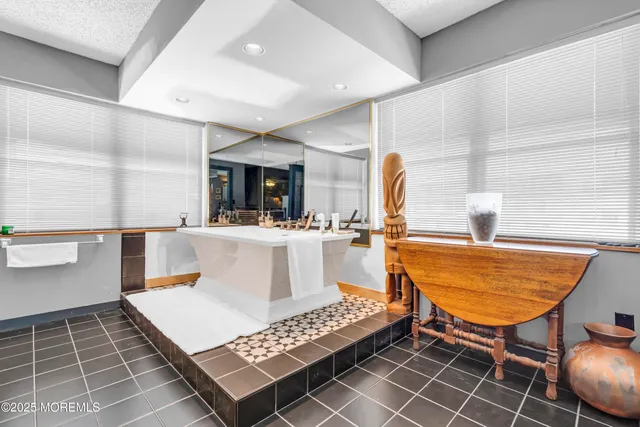 a living room with furniture a rug and a fireplace