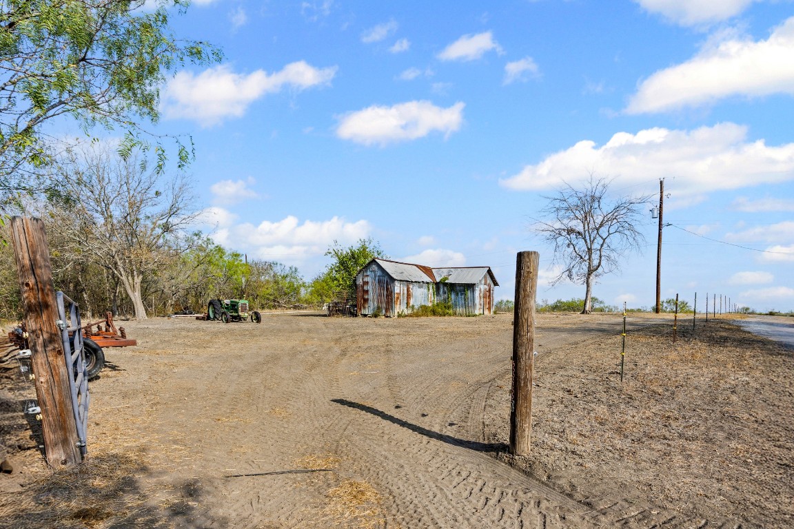 13800 Hokanson Road Del Valle, TX 78617 - Photo 2 of 16 a view of a dry yard with a house