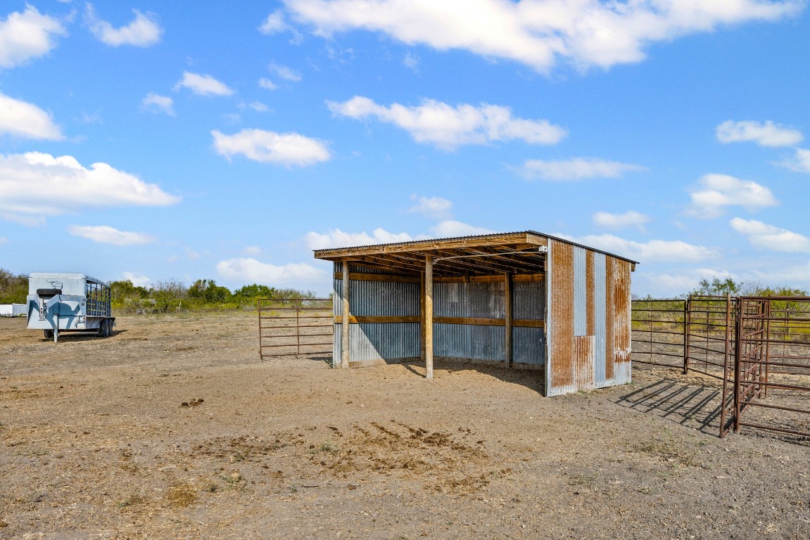 13800 Hokanson Road Del Valle, TX 78617 - Photo 3 of 16 a view of a house with a backyard
