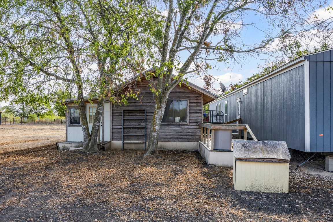 13800 Hokanson Road Del Valle, TX 78617 - Photo 5 of 16 a view of a backyard with patio