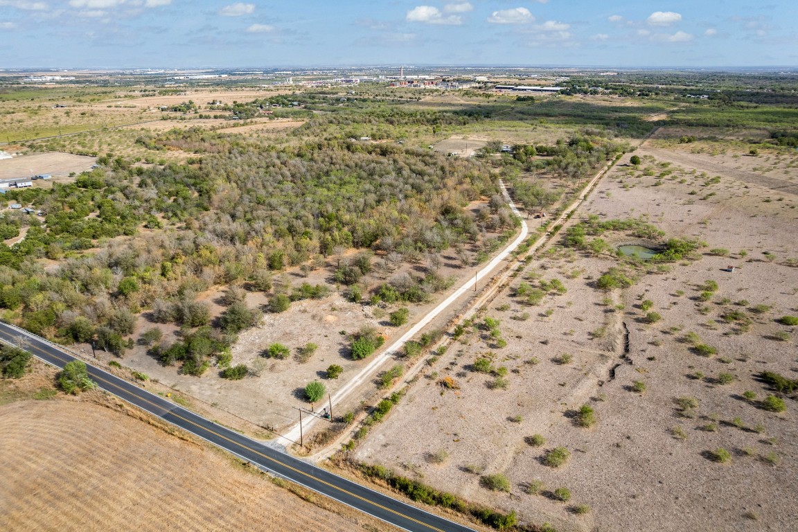 13800 Hokanson Road Del Valle, TX 78617 - Photo 7 of 16 a view of a lake with a mountain