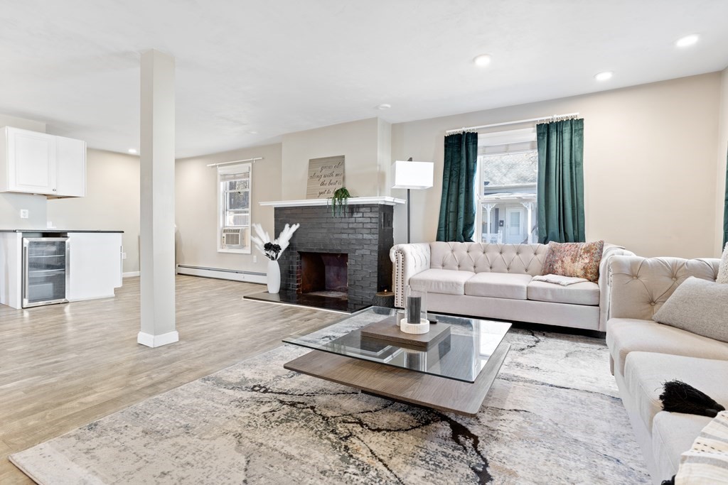 62 Union Street Gardner, MA 01440 - Photo 3 of 24 a living room with furniture and a fireplace