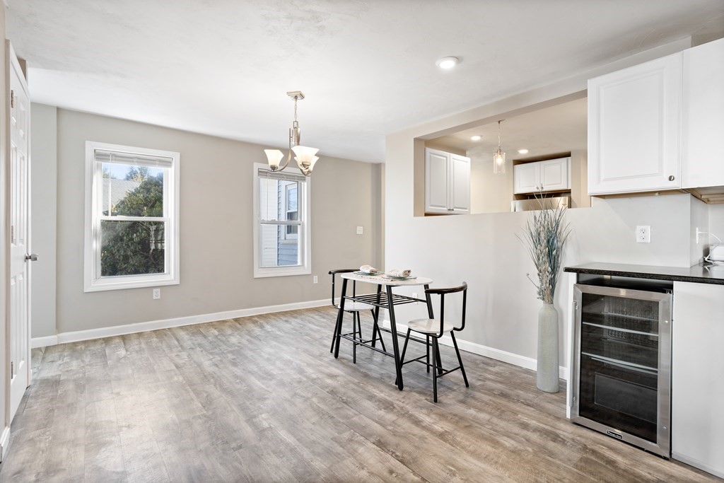 62 Union Street Gardner, MA 01440 - Photo 7 of 24 a view of a kitchen with furniture and wooden floor
