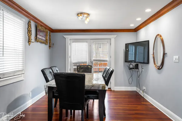 a view of a dining room with furniture window and wooden floor