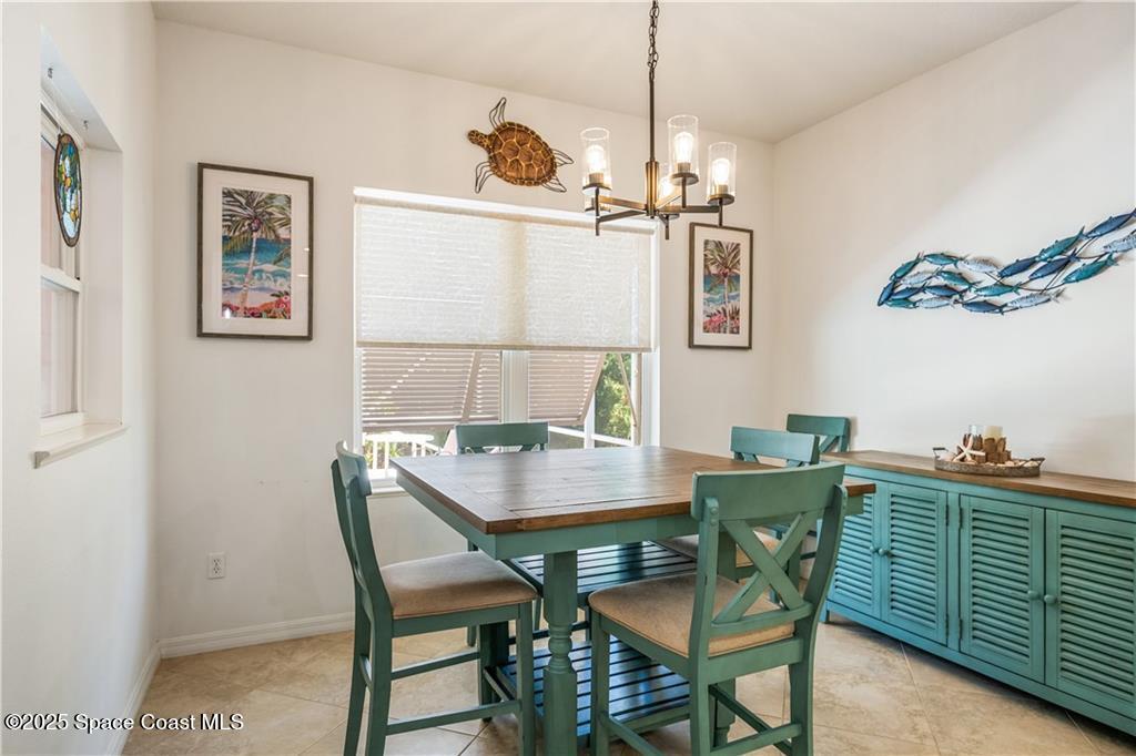 3975 Pepper Tree Street Grant, FL 32949 - Photo 11 of 36 a view of a dining room with furniture