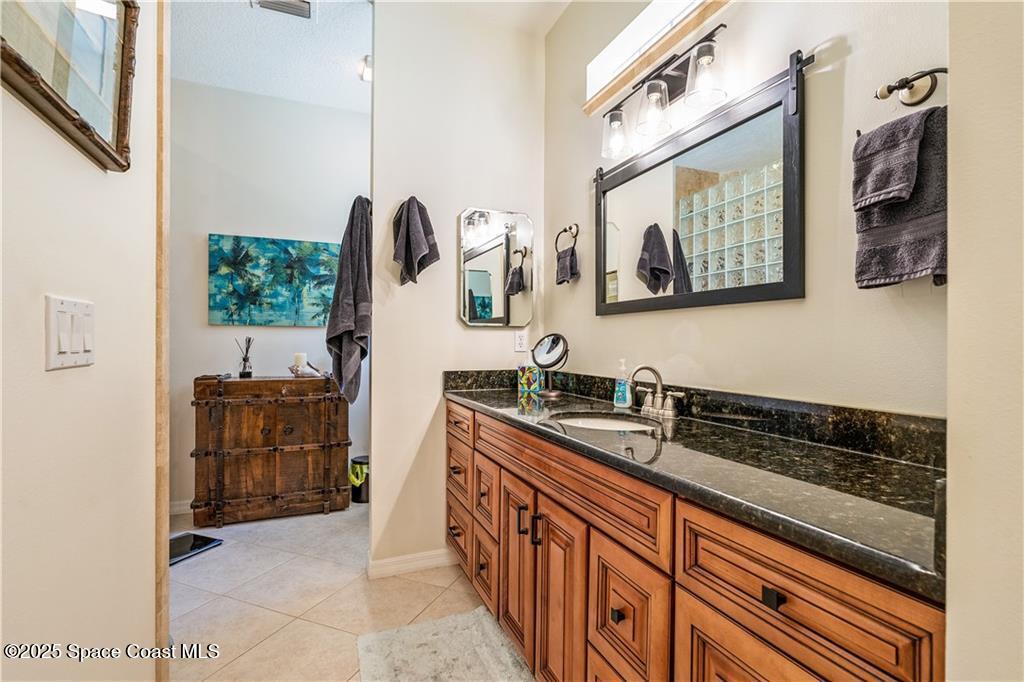 3975 Pepper Tree Street Grant, FL 32949 - Photo 17 of 36 a kitchen with stainless steel appliances a sink and cabinets