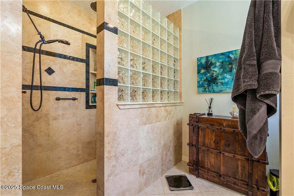3975 Pepper Tree Street Grant, FL 32949 - Photo 18 of 36 a bathroom with a shower