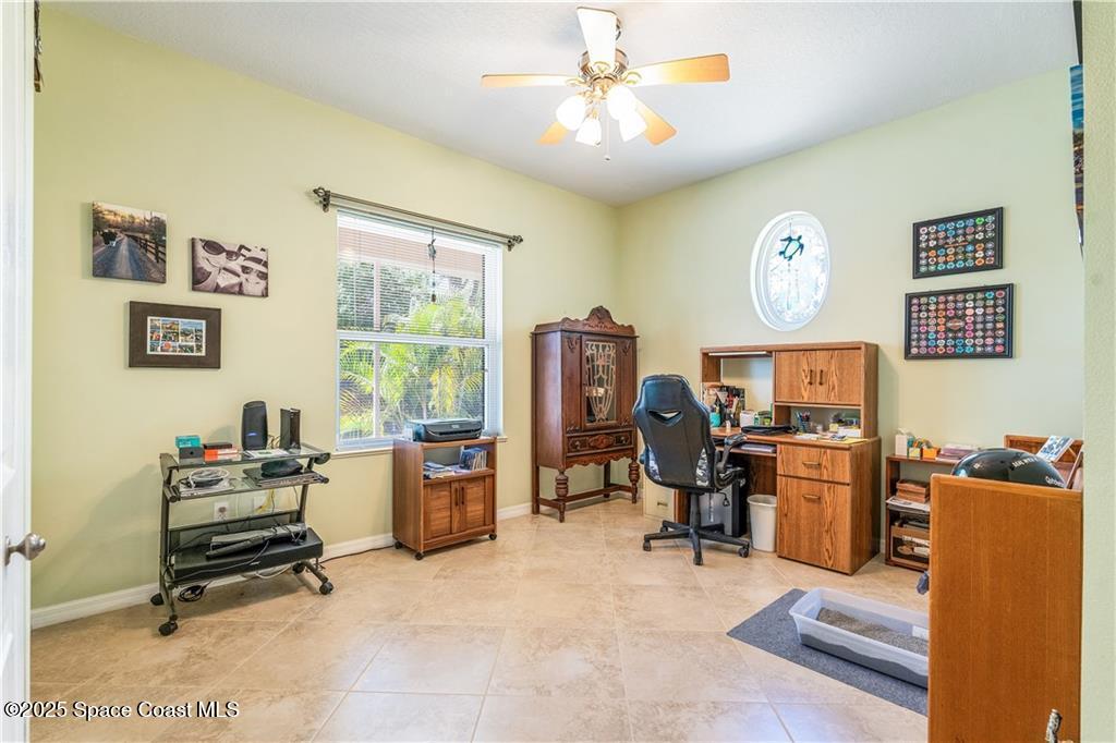 3975 Pepper Tree Street Grant, FL 32949 - Photo 21 of 36 a view of a workspace with furniture and a window