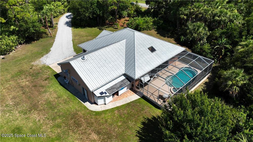 3975 Pepper Tree Street Grant, FL 32949 - Photo 27 of 36 a view of a house with a yard and trees