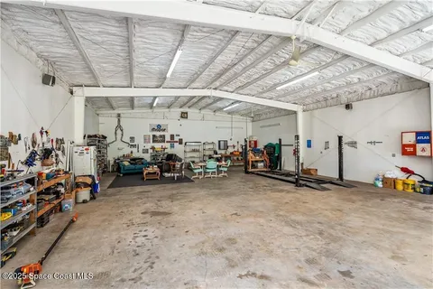 a view of a garden with a building in the background