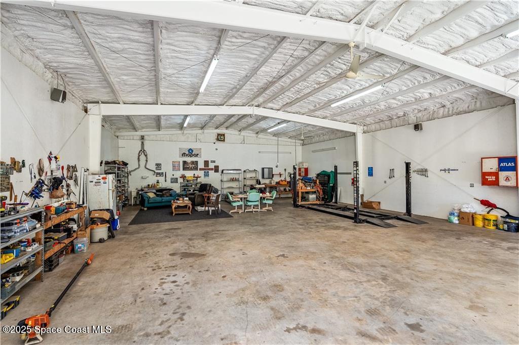 3975 Pepper Tree Street Grant, FL 32949 - Photo 30 of 36 a view of a garage with storage