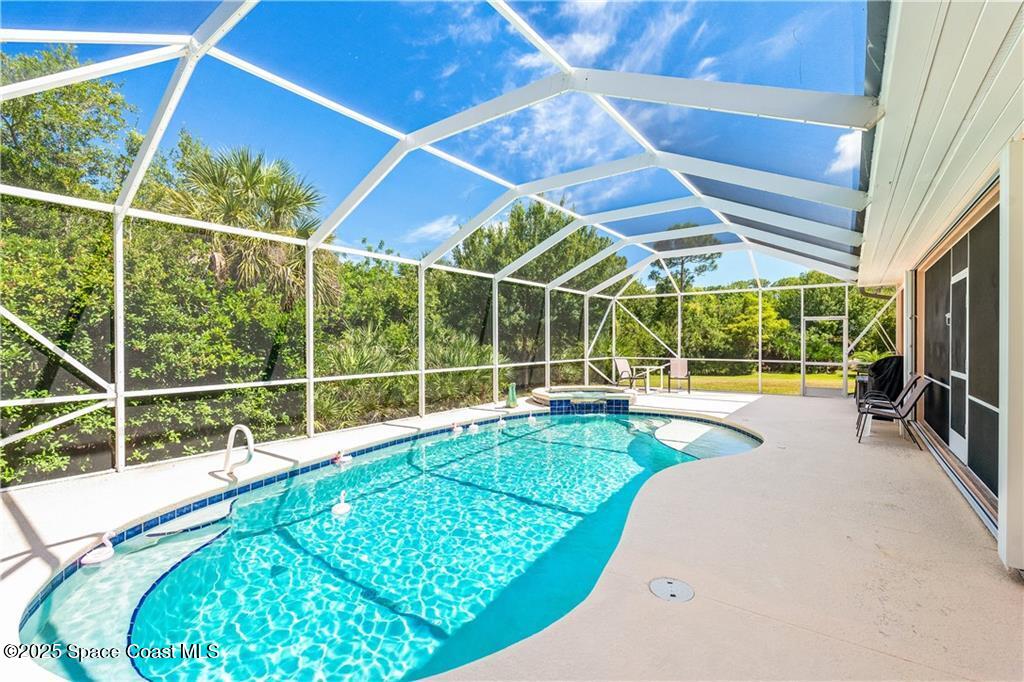 3975 Pepper Tree Street Grant, FL 32949 - Photo 3 of 36 a view of a backyard with a swimming pool