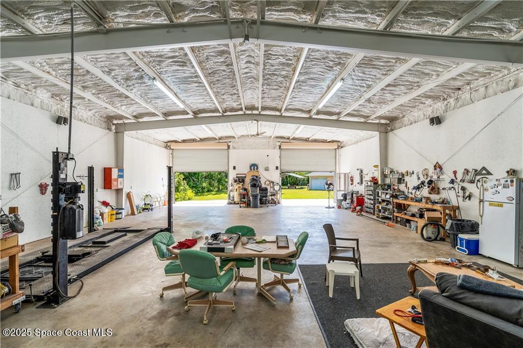 3975 Pepper Tree Street Grant, FL 32949 - Photo 31 of 36 a view of a room with gym equipment
