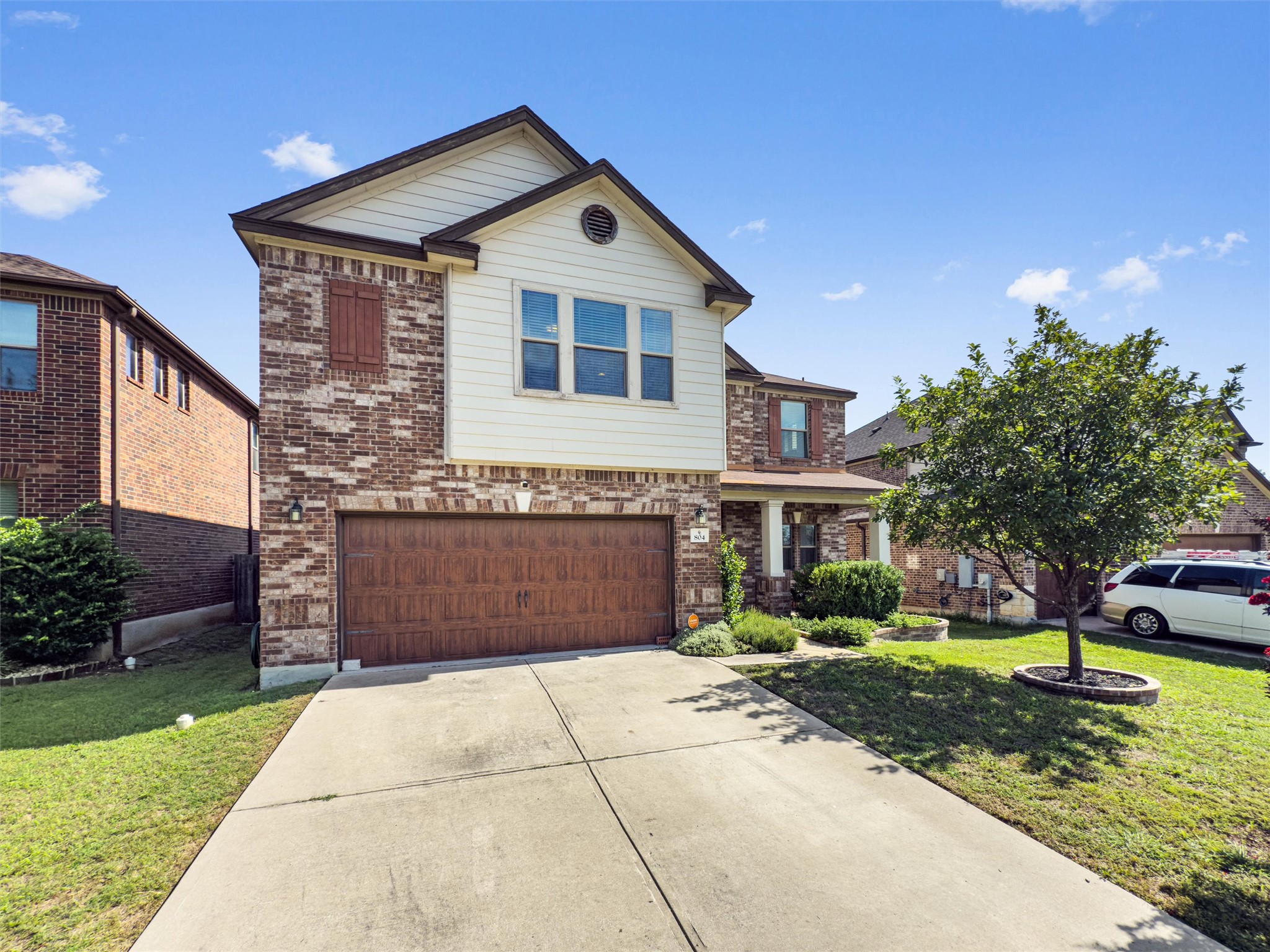 804 Water Hyacinth Loop Leander, TX 78641 - Photo 17 of 37 a front view of a house with garden