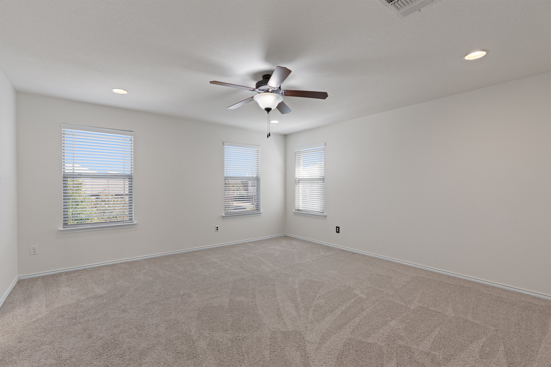 804 Water Hyacinth Loop Leander, TX 78641 - Photo 19 of 39 Tucked away upstairs for added privacy, the spacious primary suite offers a quiet sanctuary to unwind at the end of each day.