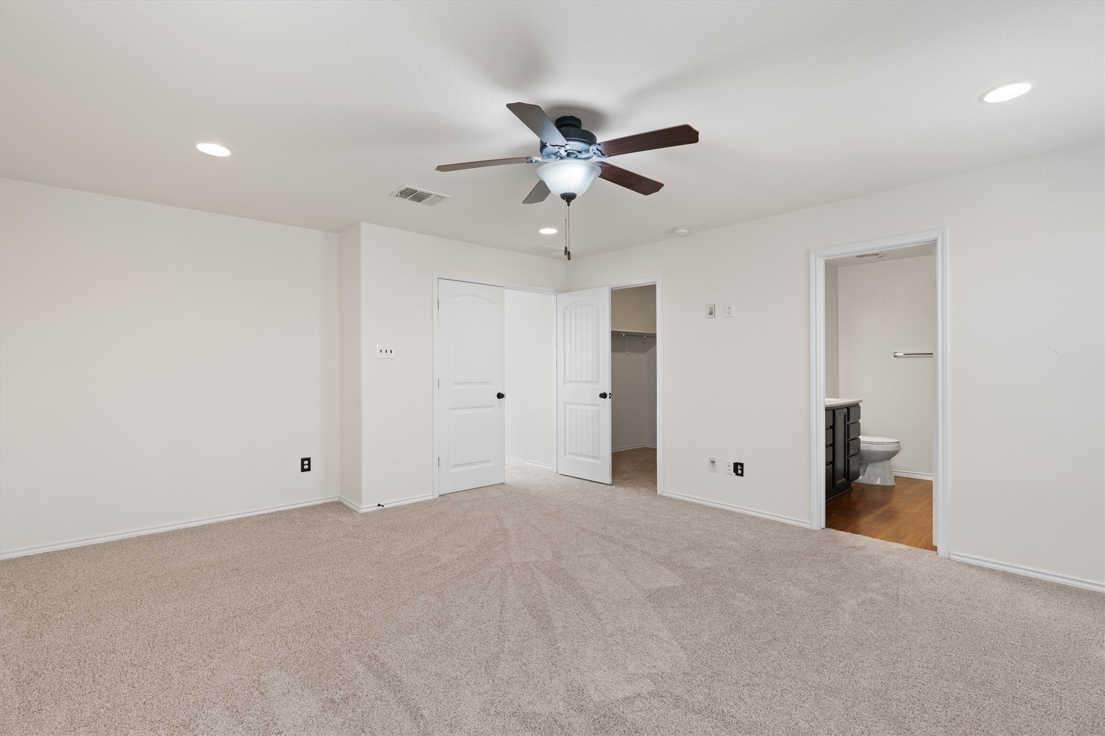 804 Water Hyacinth Loop Leander, TX 78641 - Photo 20 of 39 A generous walk-in closet provides plenty of space for clothing, shoes, and accessories—no need to compromise on storage.