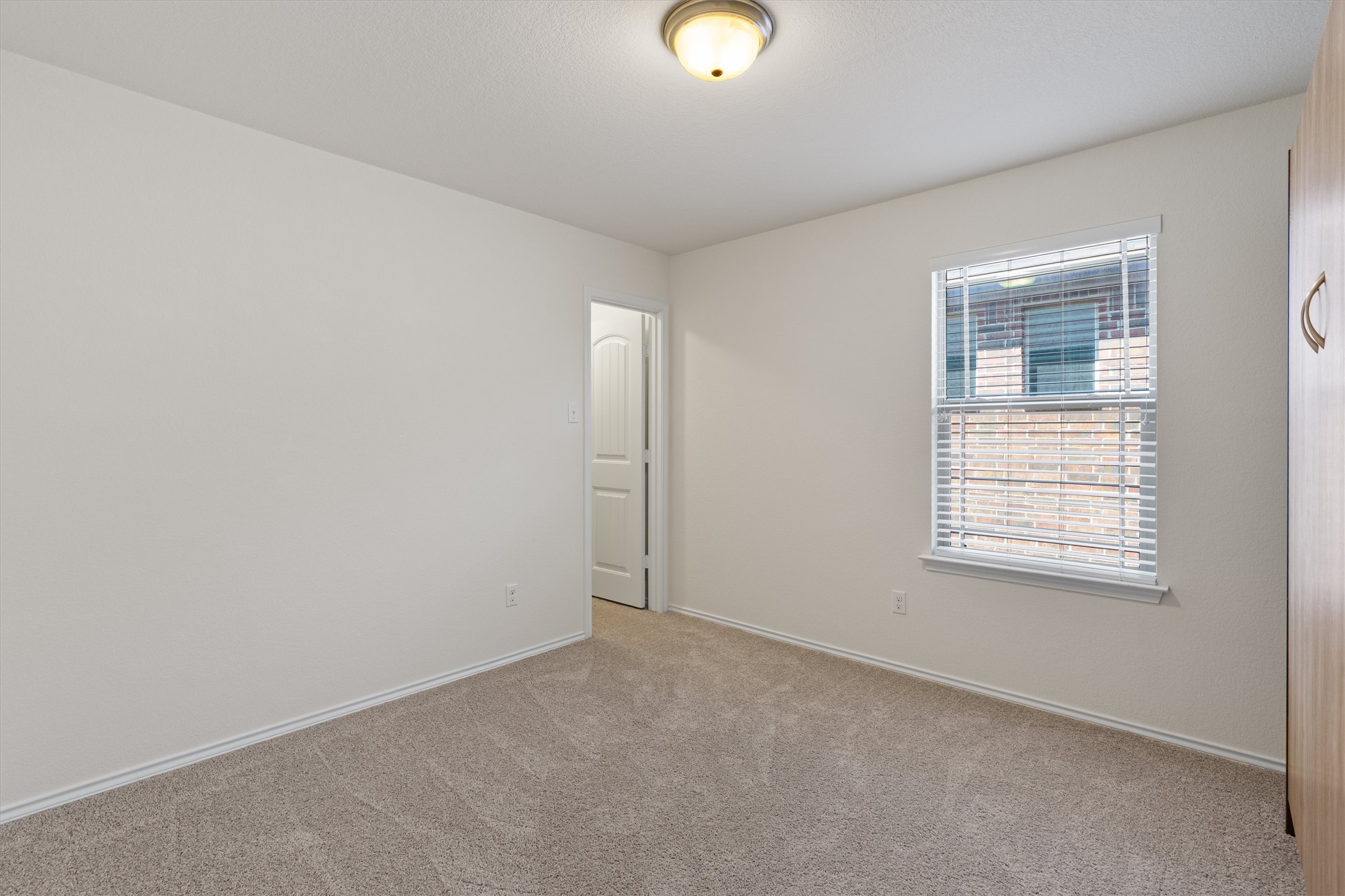 804 Water Hyacinth Loop Leander, TX 78641 - Photo 24 of 39 Each guest bedroom offers a cozy, comfortable space with soft carpeting and generous closet storage.